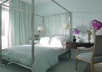 bedroom with table chair and flower